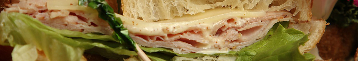 Eating Deli Sandwich Vietnamese at Seattle Deli restaurant in Edmonds, WA.